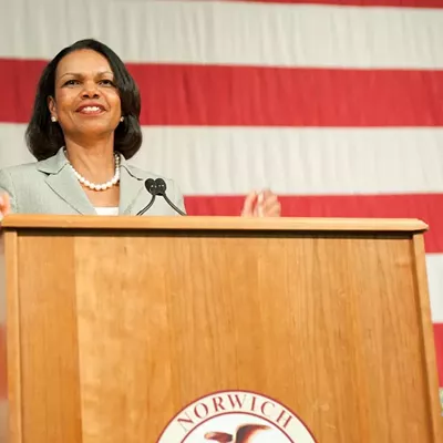 Image: Rice speaks at Norwich Amid Protests