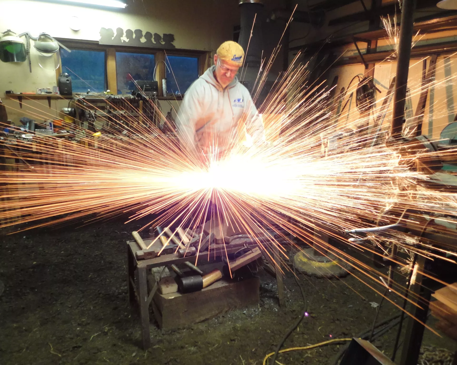 Doc Bagley striking iron at Four Winds Forge