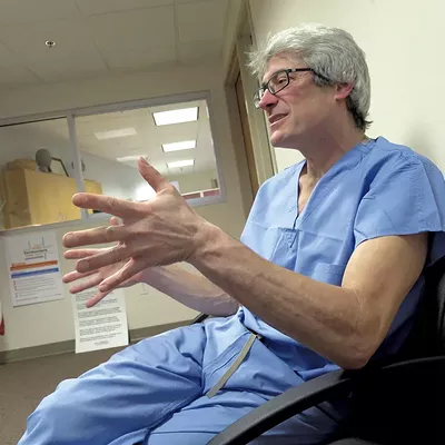 Image: State Medical Examiner Placed on Leave, Faces Hearing