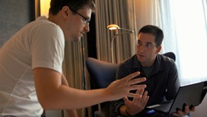 Edward Snowden (L) speaks with Glenn Greenwald in the film Citizenfour.