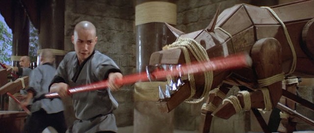 A monk fights a weird, silver-toothed wolf in Eight Diagram Pole Fighter - SHAW BROTHERS