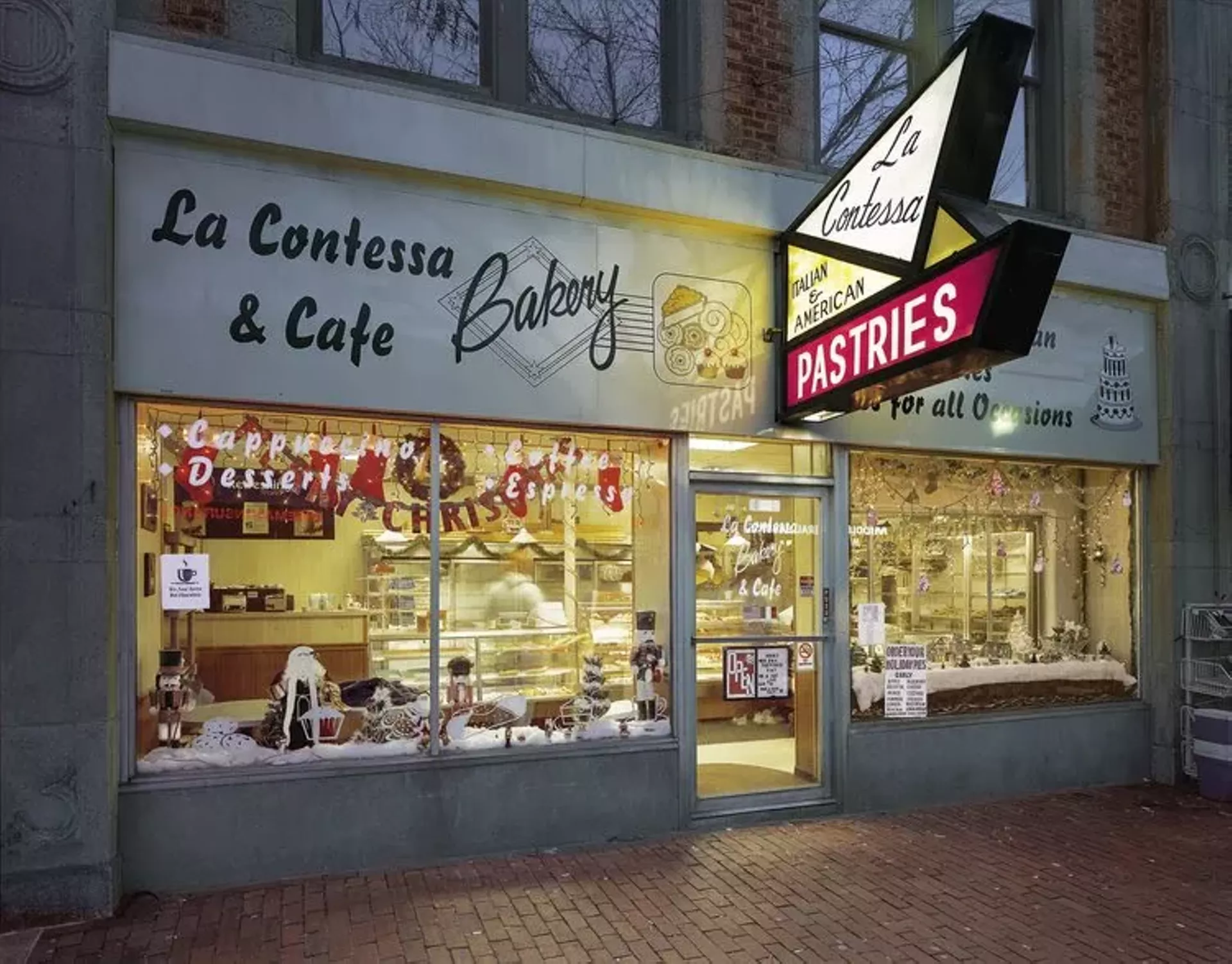 "Front of 'La Contessa Bakery & Cafe' decorated for Christmas" by Jim Dow