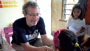 Barry Finette treating children in the Philippines