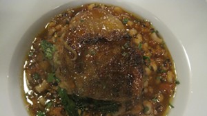 Braised chicken thigh over chorizo black-eyed peas