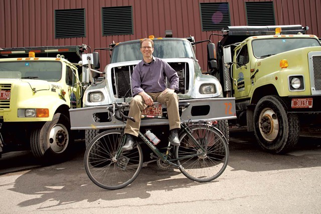 Department of Public Works director Chapin Spencer and a row of city trucks - FILE: MATTHEW THORSEN