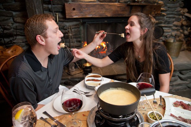 Chuck and Kristen Vella enjoying fondue at Emily's at Stowehof Inn & Resort - MATTHEW THORSEN