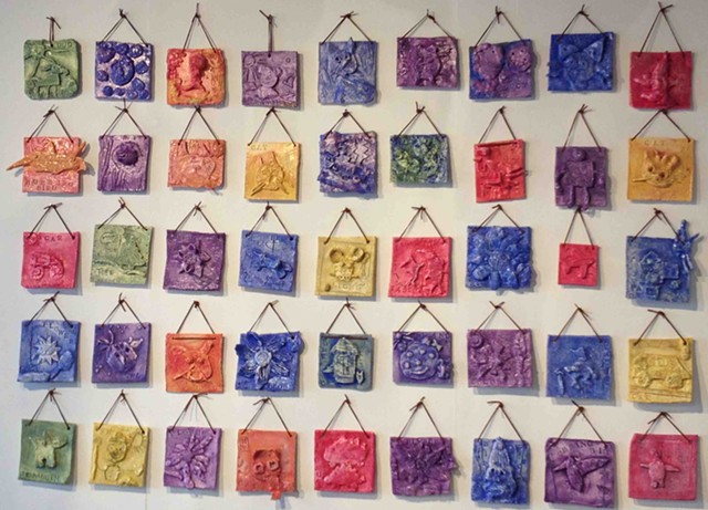 Clay relief tiles by IAA kindergarten students, with BCA teaching artist Kim Desjardins - XIAN CHIANG-WAREN
