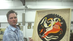 Ethan Merrill with a Szoeke cut-felt zodiac sign