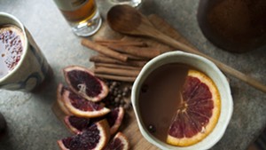 Cold? This hot cider cocktail is half tea, half juice, with a shot of booze for fun.