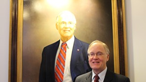 Former governor Jim Douglas and his official portrait, painted by Kate Gridley
