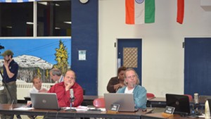 Greg Jenkins, right, at a recent board meeting. At left sits his ward-mate, David Kirk.