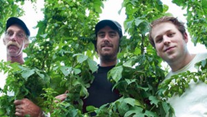 Ian Birkett, in black, his dad Joe Birkett (in glasses) and Fletcher Bach operate Square Nail Hops Farm in Ferrisburgh.