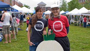 Jessica Bridge (left), co-owner of Aartistic Inc. and president of the Winooski Community Partnership, and Winooski city manager Katherine &#8220;Deac&#8221; Decarreau. That's the new Winooski Community Partnership logo on their shirts.