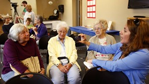 Lynn Monty interviews Sally Young of Milton as she sits with Jane Lafayette (center) and Ruth Marcoux, all of Milton, last September.