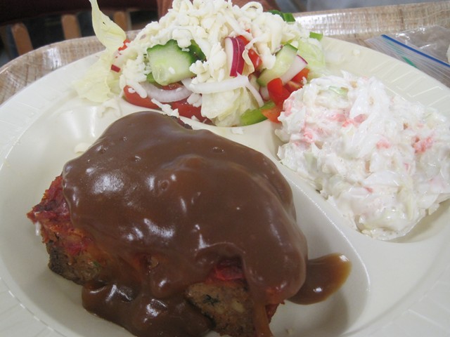 Meatloaf with small tossed salad and coleslaw