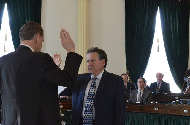 Michael Sirotkin, D-Chittenden, is sworn into the Vermont State Senate by senate secretary, John Bloomer. - PHOTO BY ALICIA FREESE
