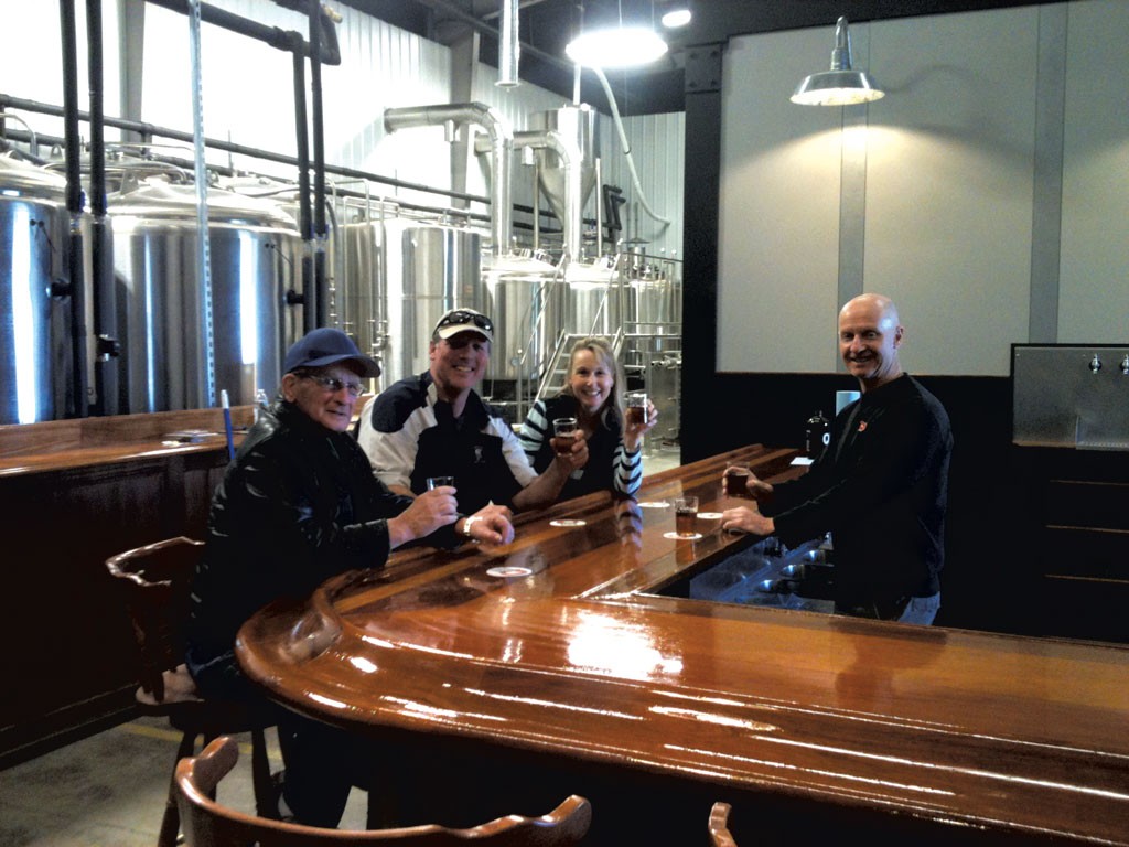 Phil Kaszuba (right) and friends - COURTESY OF QUEEN CITY BREWERY