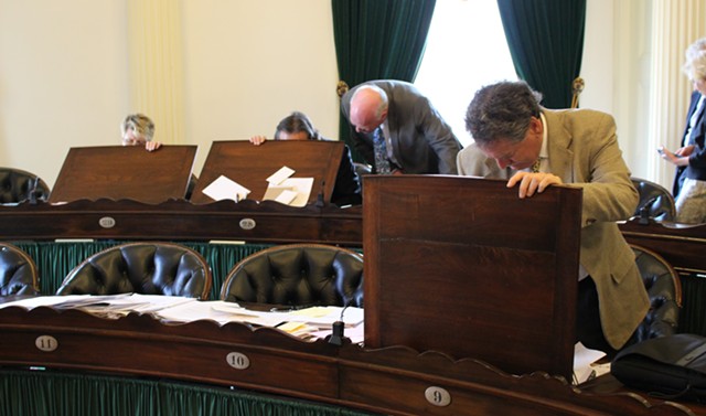 Senators clean out their desks. - PAUL HEINTZ