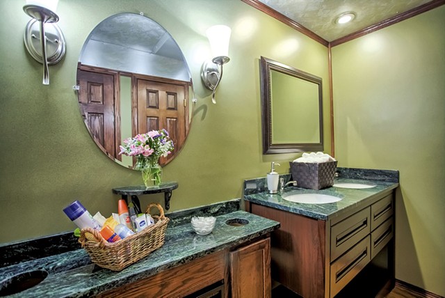 Serpentine stone countertops - COURTESY OF LUXURY EVENT RESTROOMS