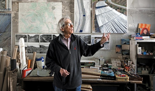 Christo in his studio with a preparatory collage for "Over the River," 2011 - PHOTO: WOLFGANG VOLZ © 2011 CHRISTO