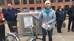 Local Motion executive director Emily Boedecker stands outside Champlain Mill during a press conference announcing the installation of bike lockers in Winooski and Burlington.