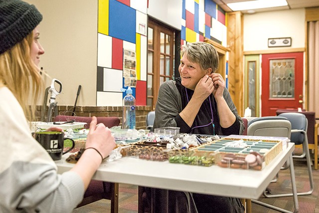 Sara Glasgow (right) making jewelry with a guest at the Turning Point Center - OLIVER PARINI