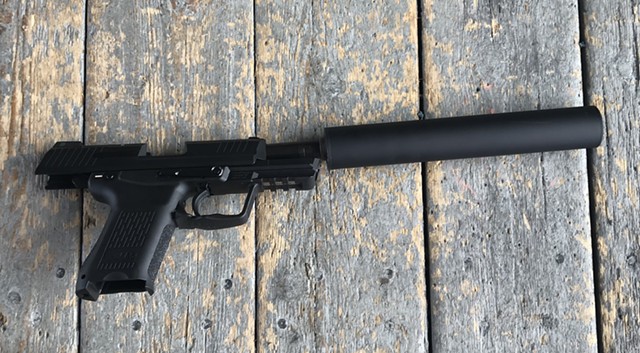 Suppressed Heckler & Koch .45 caliber pistol - TAYLOR DOBBS