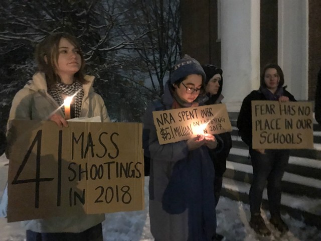 UVM students demonstrated outside the Ira Allen Chapel before a gun rights discussion Thursday. - TAYLOR DOBBS