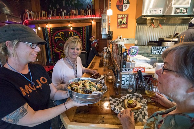 Mojo Café owner Jodi Seward serving local customers Pam McLaughlin and Leanne Jewett lobster nachos - TOM MCNEILL