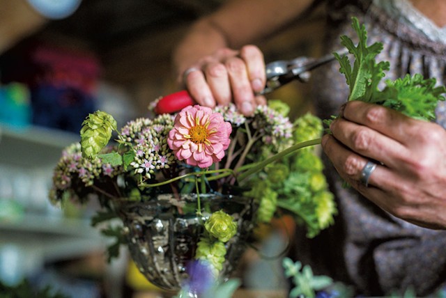 Diane Doll preparing an assortment of fresh-cut flowers at Stray Cat Flower Farm in Burlington - GLENN RUSSELL