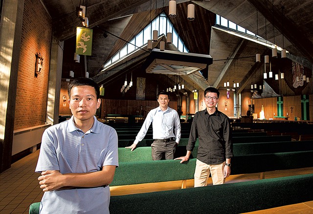From left: Giang Vu, Thang Nguyen and Luan Tran at the Chapel of St. Michael the Archangel on the campus of Saint Michael's College - GLENN RUSSELL