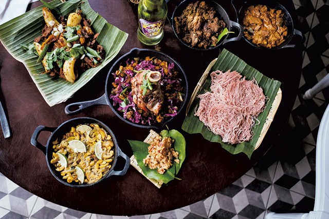 An assortment of dishes, including Welcome to Jaffna (goat curry), Kandy Man (pork curry), string hoppers, red coconut sambol, Ella's Garden (cashew curry), deviled beef and kottu roti with lamb - COURTESY OF NAMA | MICHAEL VESIA