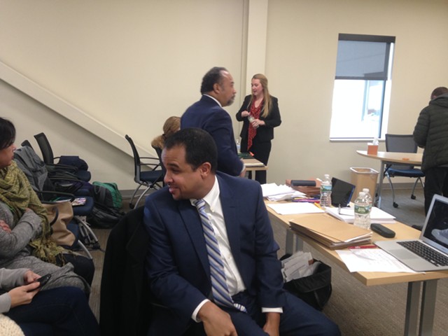 Mario Macias turns to speak with family members at Friday's hearing. His lawyer, Francisco Guzman, stands in the background. - MOLLY WALSH
