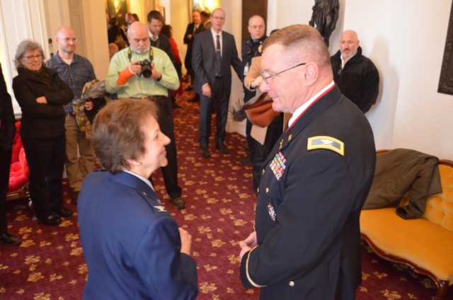 Col. Greg Knight speaks to retired colonel Rosanne Greco after  his election as the state's new adjutant general. - KEVIN MCCALLUM