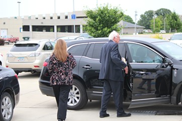 Jane Sanders and Sen. Bernie Sanders walk to their car outside Iowa Central Community College Thursday in Fort Dodge, Iowa. - PAUL HEINTZ