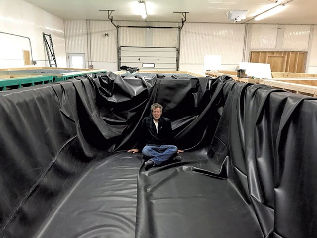 John Brawley of Sweet Sound Aquaculture in a shrimp tank - COURTESY OF JOHN BRAWLEY