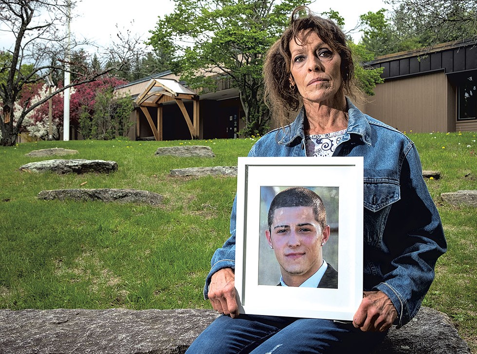 Cheryl Rusin holding a photo of her son Connor - ZACH STEPHENS