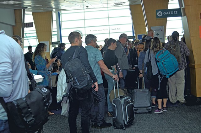 Passengers waiting to board a flight at Burlington International Airport - MOLLY WALSH
