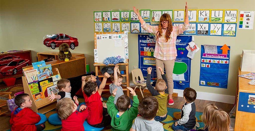 Teacher Dolly Spooner telling a story to the kids at the Newport Early Childhood Center - WAYNE TARR