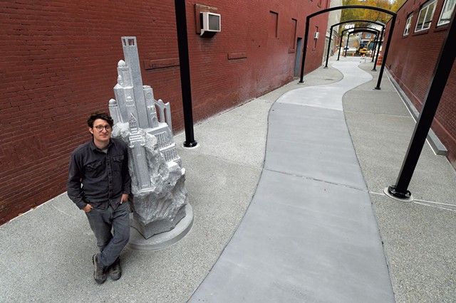 Sean Hunter Williams with his granite sculpture "Culmination" - JEB WALLACE-BRODEUR