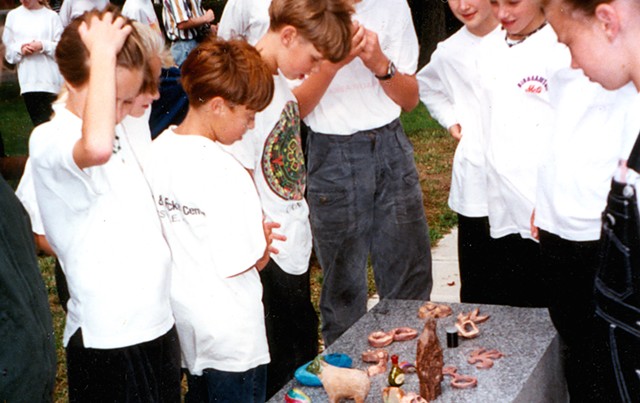 Children look at their artworks to be buried under "Zig Zag" in 1994 - COURTESY OF KATE POND