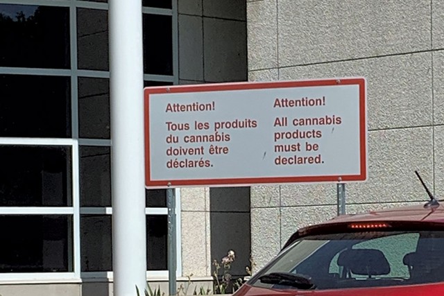 Sign at the Canadian border - JOHN JAMES
