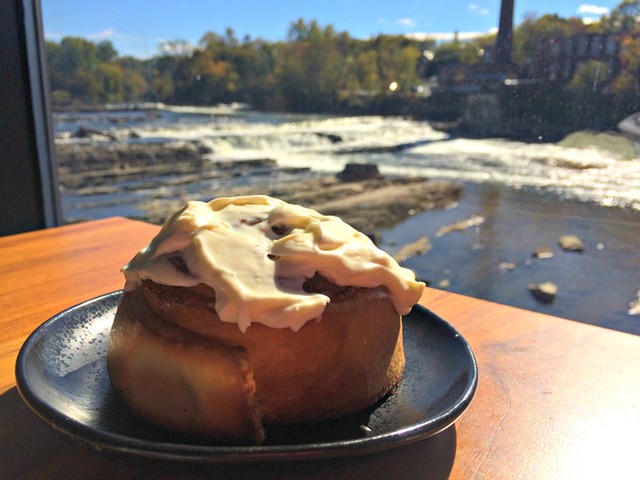 Housemade cinnamon roll ($5) in front of the falls - ALICE LEVITT