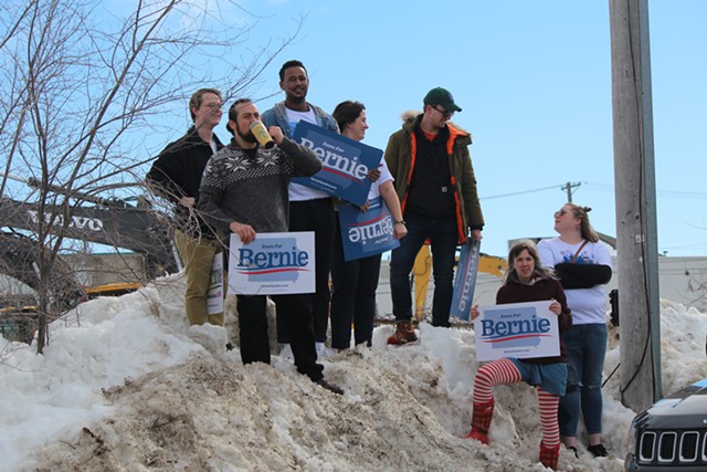 Supporters of Sen. Bernie Sanders watching him speak outside his field office in Cedar Rapids, Iowa - PAUL HEINTZ