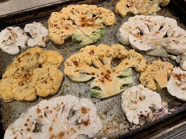 Smoked paprika and honey-brushed cauliflower steaks headed into the oven - MELISSA PASANEN