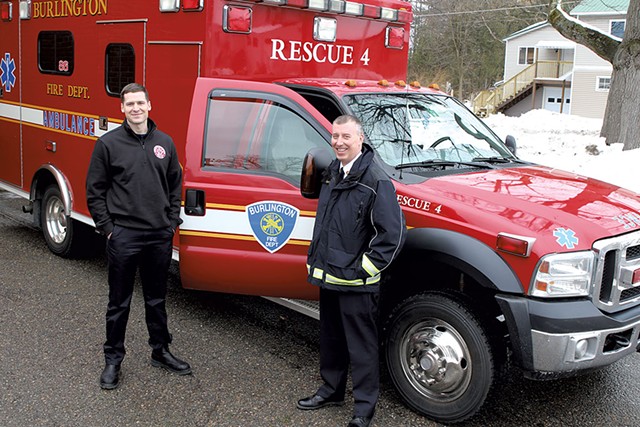 Firefighter Kyle Blake (left) and Fire Chief Steven Locke with the unmanned ambulance - COURTNEY LAMDIN
