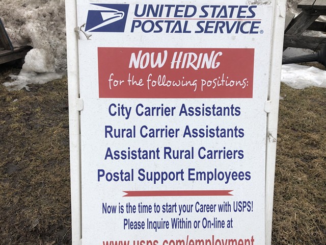A help wanted sign at the Pine Street facility's parking lot - MOLLY WALSH
