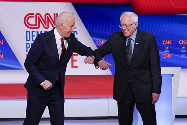 Former vice president Joe Biden and Sen. Bernie Sanders preparing to debate Sunday night in Washington, D.C. - ASSOCIATED PRESS