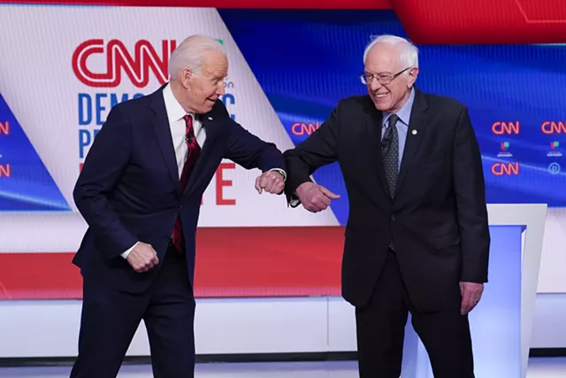 A Virus Takes Center Stage as Biden and Sanders Debate