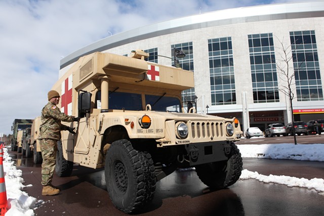 Vermont National Guard members arriving at the University of Vermont Medical Center to set up tents - KEVIN MCCALLUM